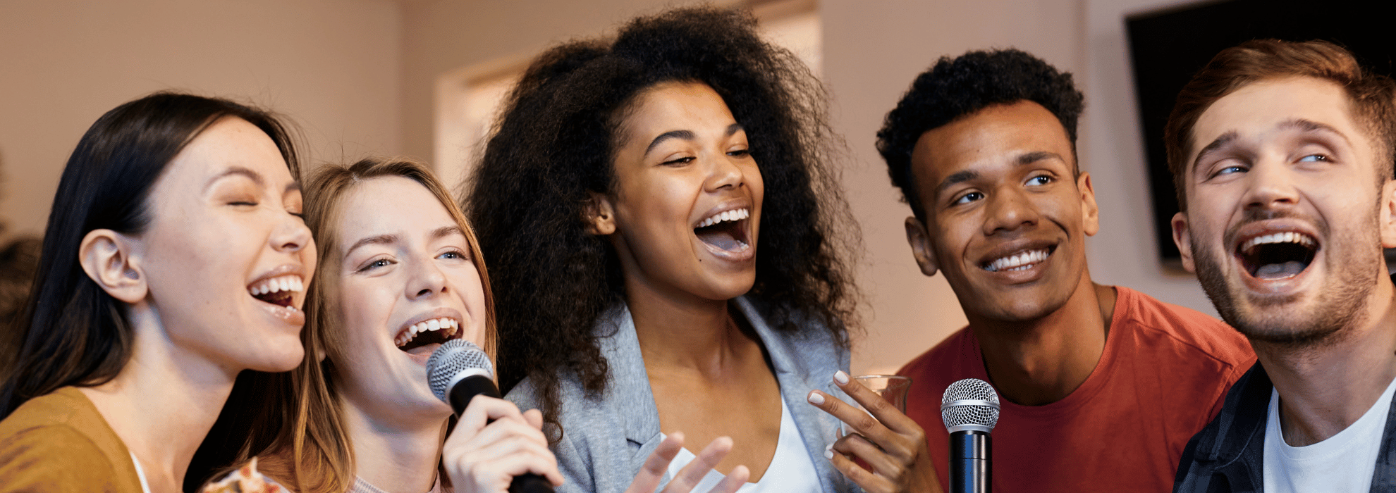 Happy people singing and using the Music Curriculum